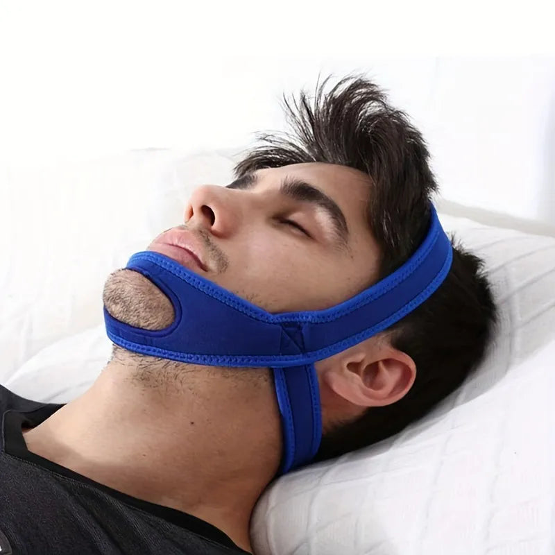 Anti-snoring chin strap black color worn during sleep