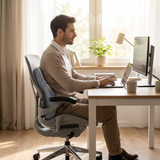 Memory foam lumbar support cushion in use at a home office desk
